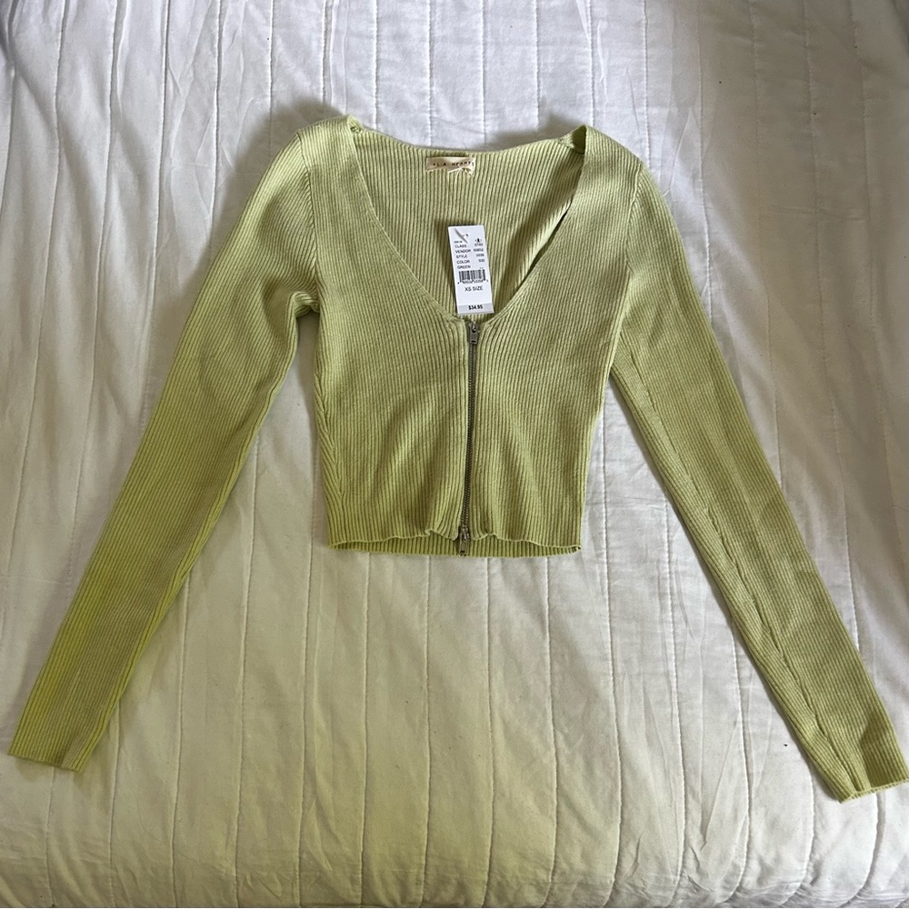 Light green zip-up crop top from Pacsun!